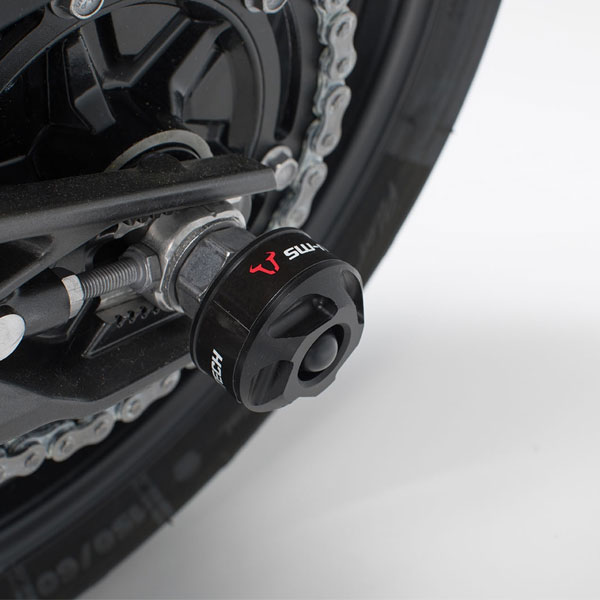 Tope protector de eje trasero para motocicleta